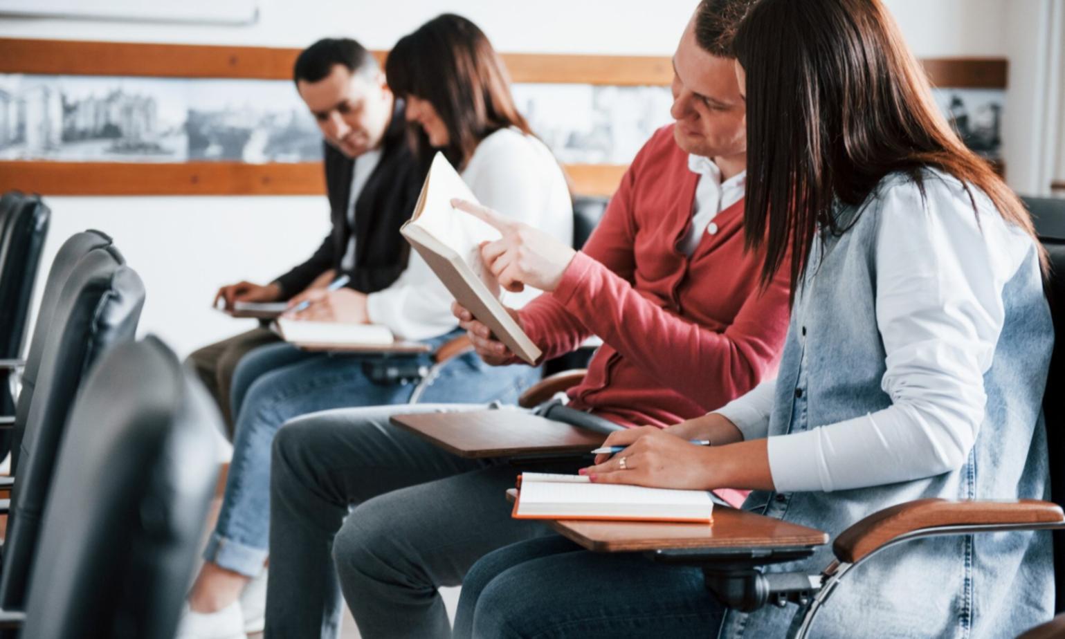 Financial planning discussion session with documents and laptop