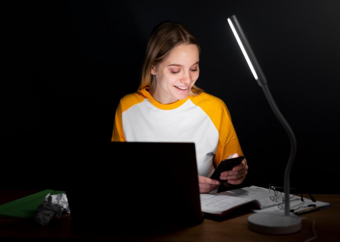 Person reviewing financial documents with calculator and notes spread across desk